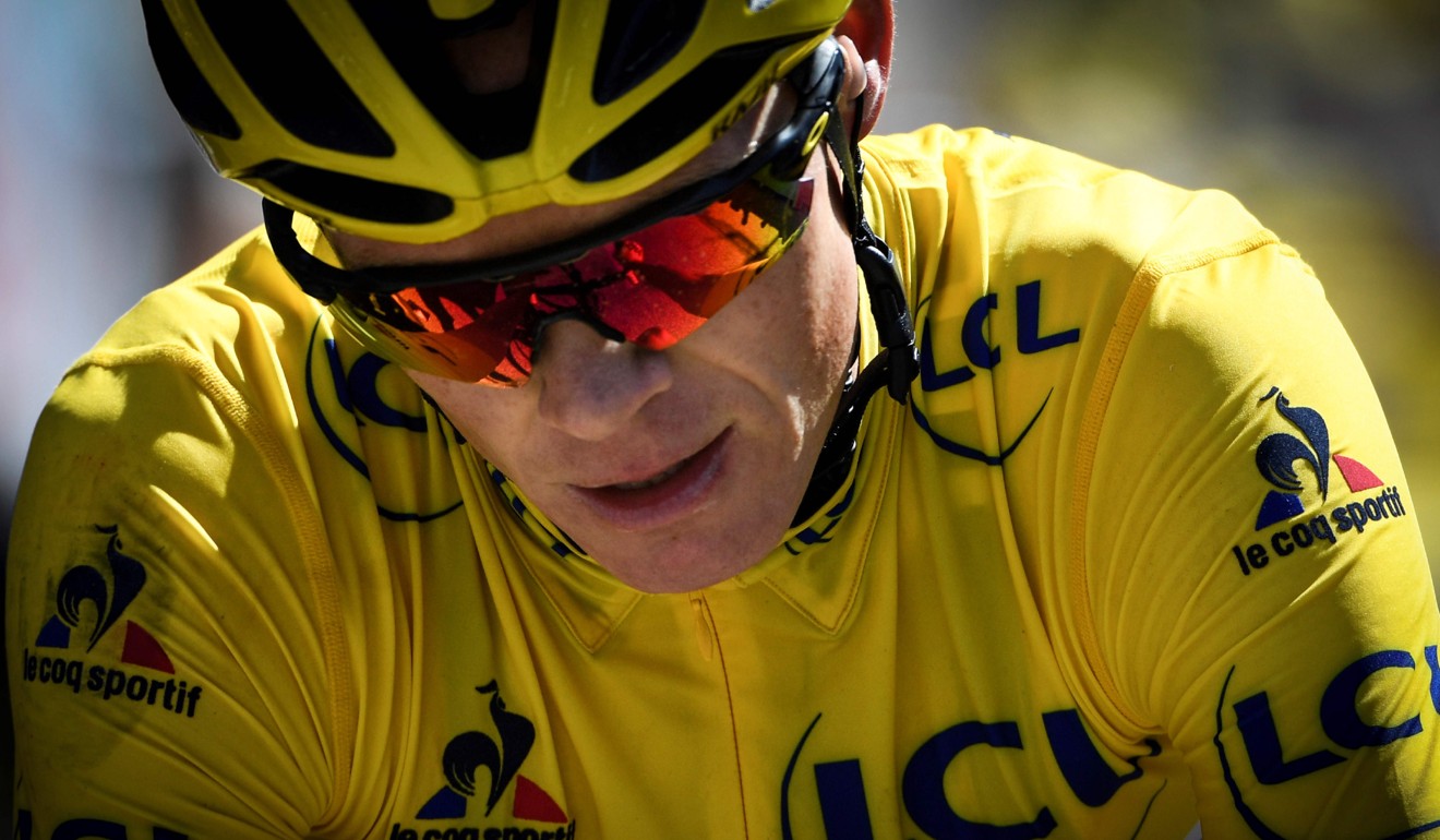 Chris Froome carries the Tour de France leader’s yellow jersey.