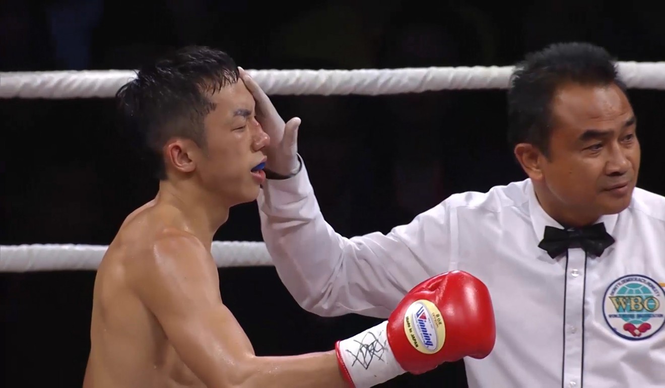 Rex Tso feels the impact of an accidental headbutt during his bout against Kohei Kono. Photo: Unus Alladin