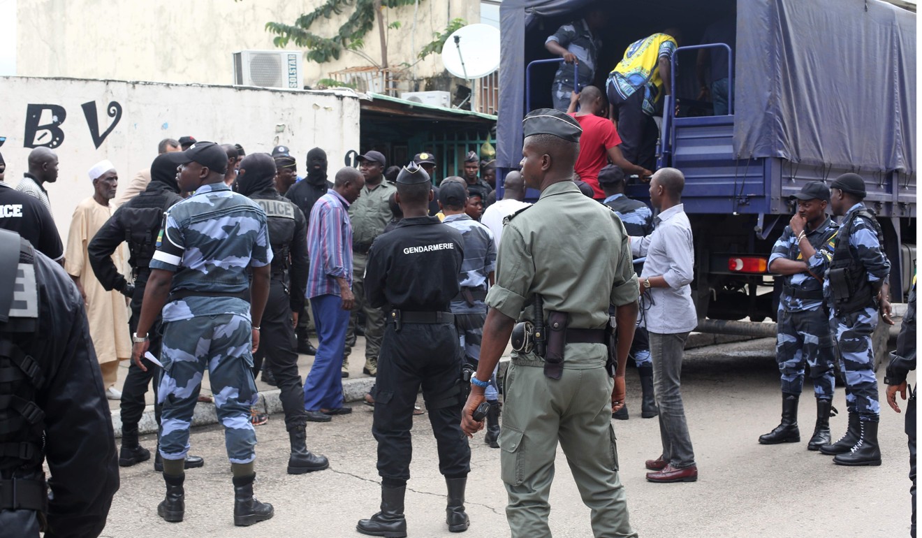Police officers at the market in Libreville. Photo: AFP
