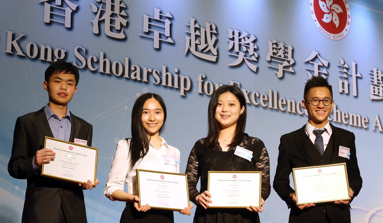 Four of the first batch of 78 winners of the Scholarship for Excellence Scheme pose for media at the government headquarters in Tamar, on August 21, 2015. Photo: Dickson Lee