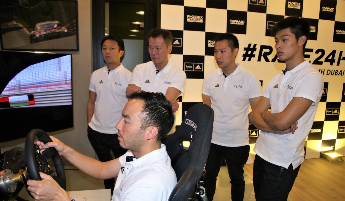 Darryl O'Young in a simulator is watched by Marchy Lee, Charles Kwan, Adderly Fong and Shaun Thong.