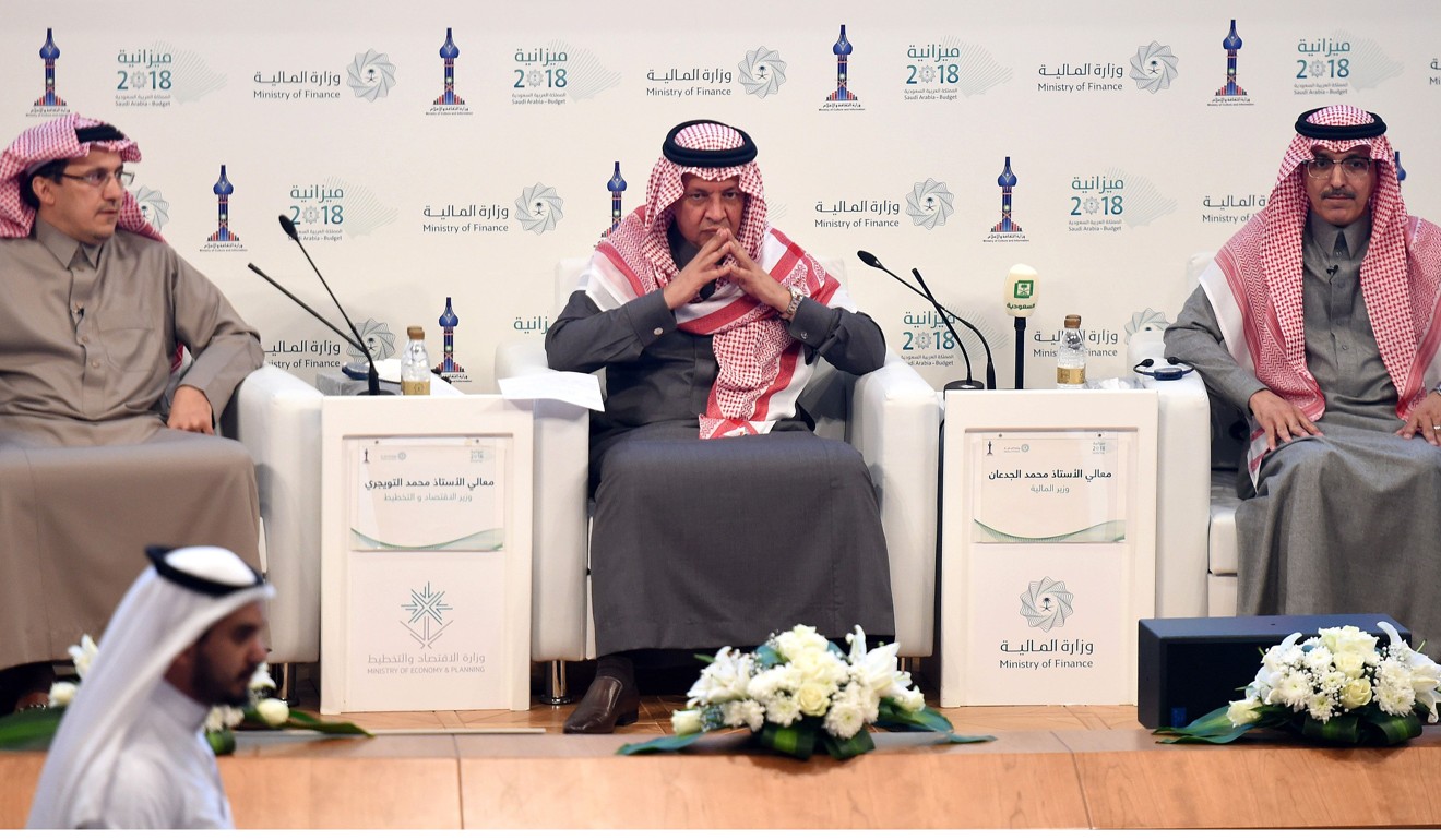 Saudi Finance Minister Mohammed al-Jadaan (right), Minister of Economy and Planning Mohammed al-Tuwaijri (centre) and Saudi Arabian Monetary Agency Governor Ahmed al- Khulaifi take part in a press conference during which officials announced the state budget for 2018, in Riyadh, on Tuesday. Photo: Agence France-Presse