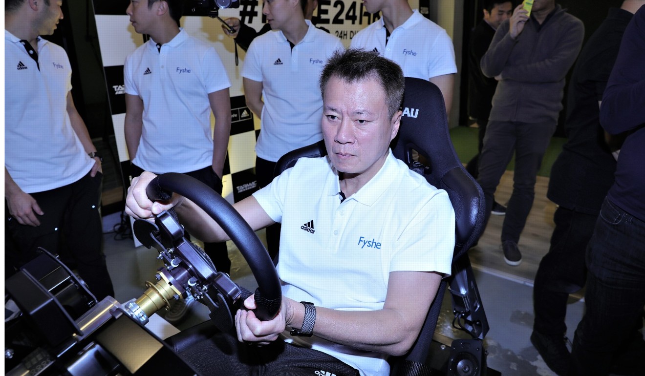 Charles Kwan shows off his skills in a simulator at the Phoenix Racing Asia headquarters in Chai Wan.