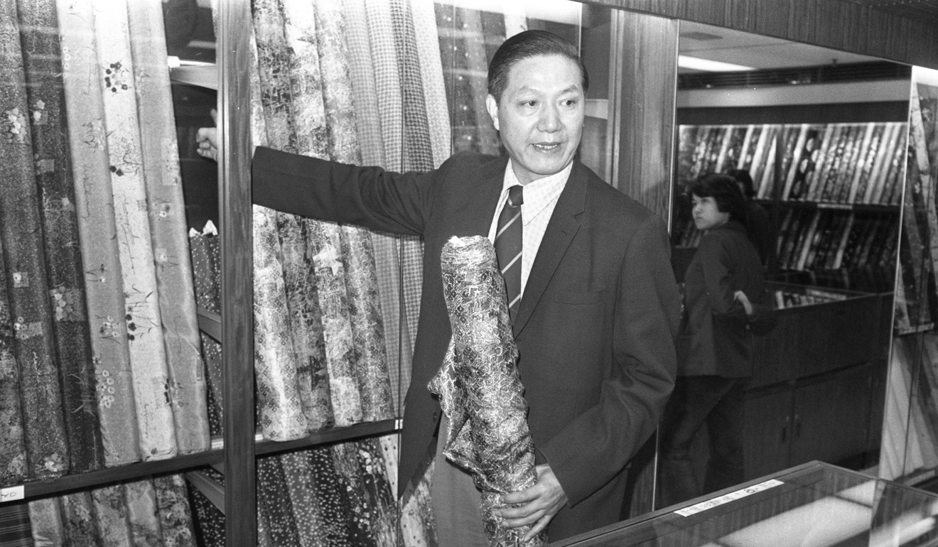 Trade official Chang Cheng showing the press some Chinese cloth. Photo: Sam Chan