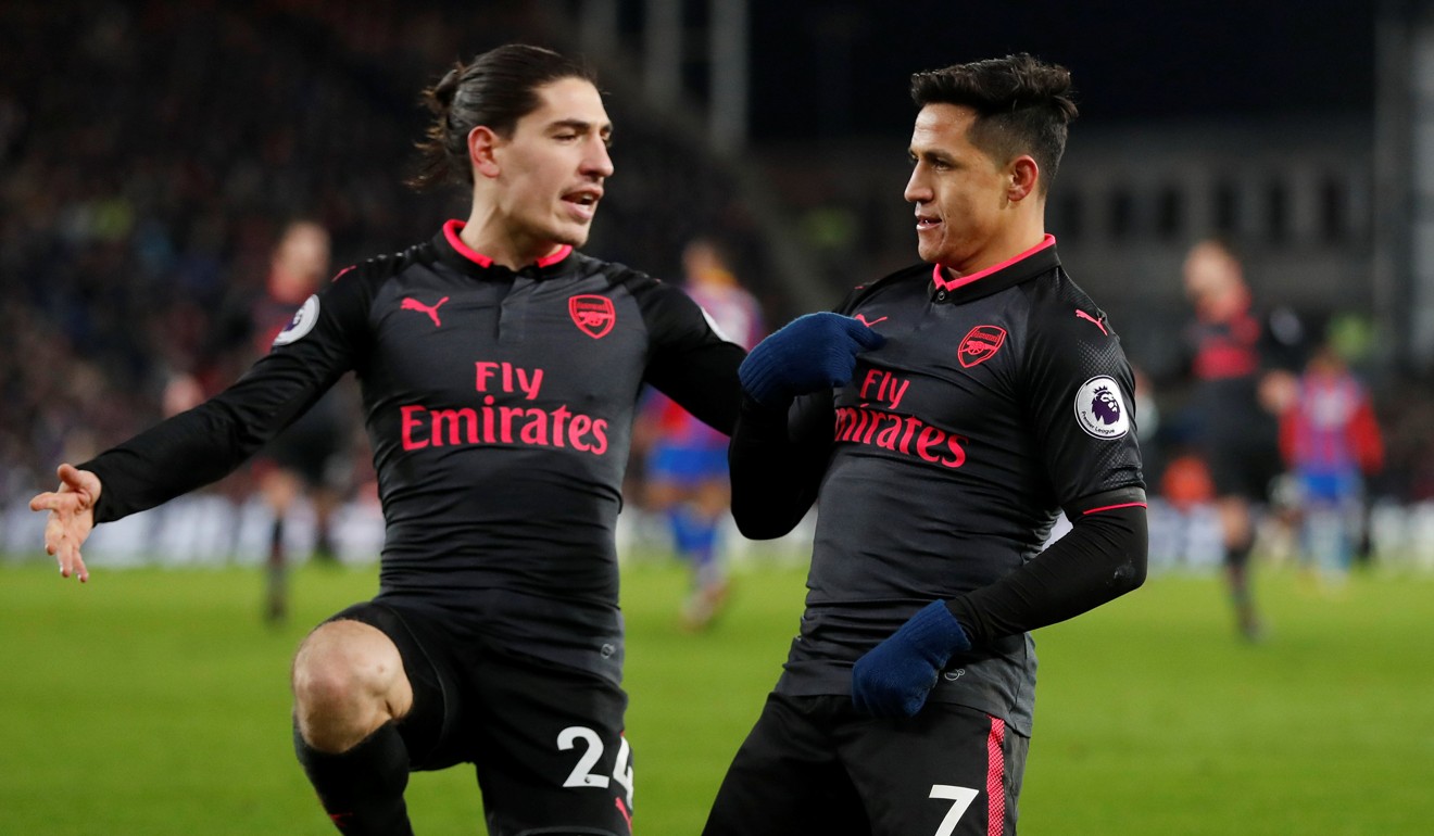 Alexis Sanchez (right) is joined by Hector Bellerin after scoring. Photo: Reuters