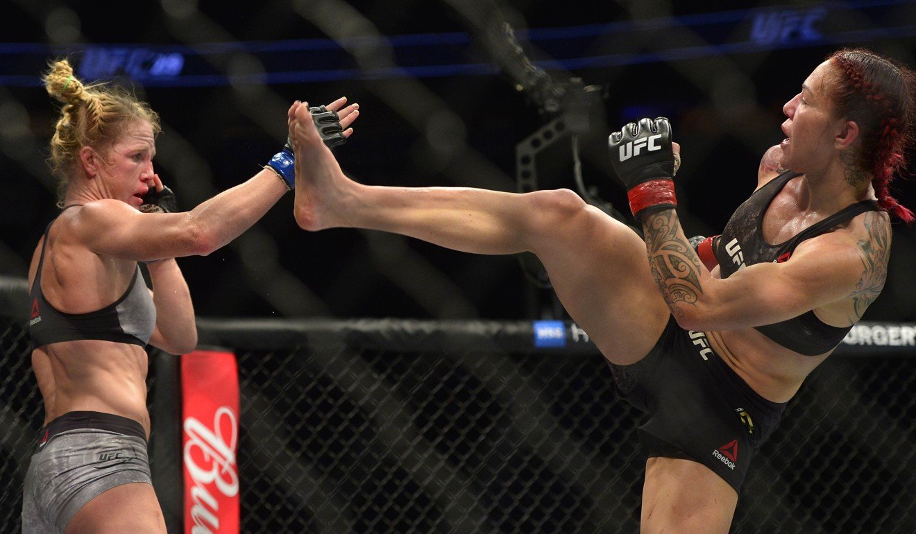Cris Cyborg moves in with a kick as Holly Holm defends during UFC 219. Photo: USA Today