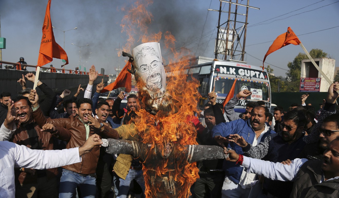 Members of India’s Rajput community burn an effigy of film director Sanjay Leela Bhansali as they protest against the release of Padmavati in Jammu. Photo: AP