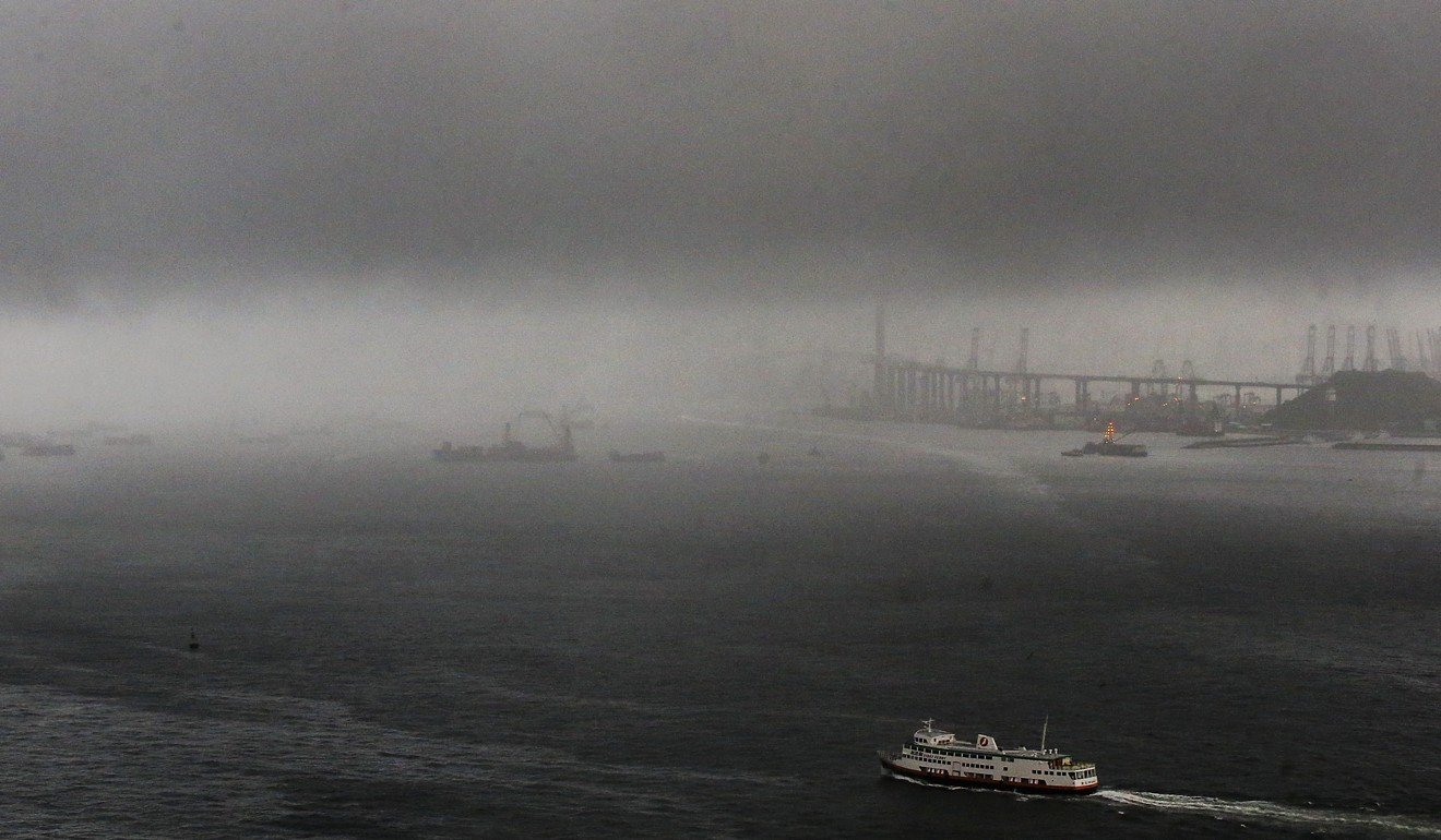 Rain clouds over Victoria Harbour. Photo: David Wong