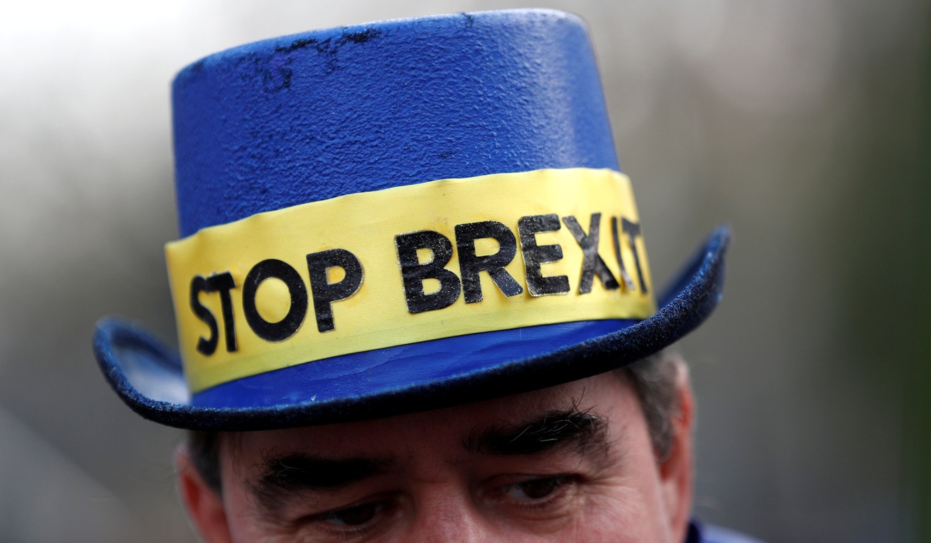 An anti-Brexit protester is seen outside Westminster in London on December 20. Britain’s prolonged exit from the European Union stems at least partially from Britain’s frustration with Europe’s debt crises at the start of the decade. Photo: Reuters