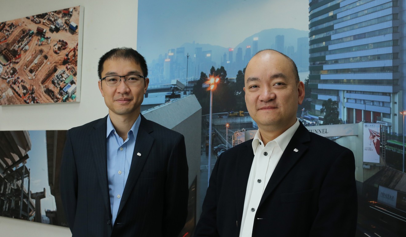 Derrick Pang (left) and Dominic Pang (right) are leading the consortium to tap opportunities to buy into construction firms in the belt and road countries as shrinking profit margins at home bite Hong Kong builders. Photo: Dickson Lee