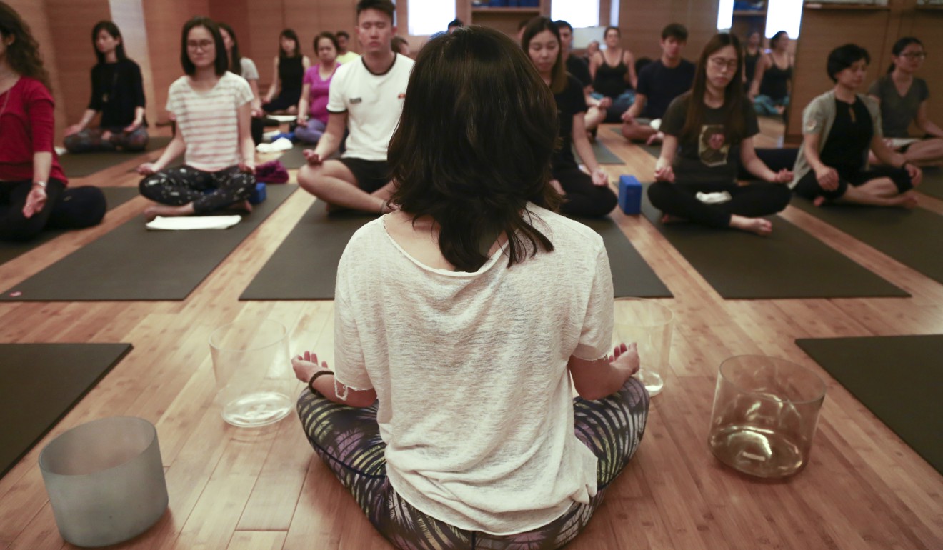 A meditation class in Hong Kong. Scientific and medical research is showing that well-being practices like meditation can alter the brain and body in ways we’re just beginning to measure and understand, including how these practices shape the anatomy of our brains and our immune and genetic responses to stress. Photo: James Wendlinger