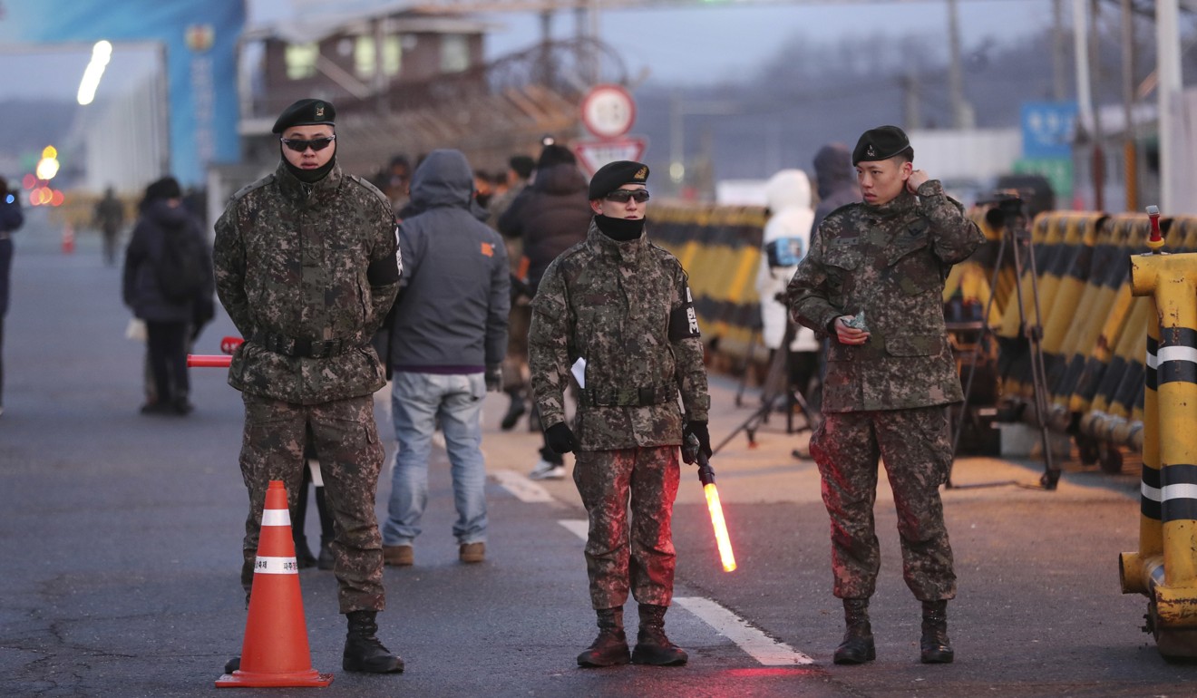 South Korean soldiers stand guard before South Korea’s delegation vehicles arrive at Unification Bridge, which leads to Panmunjom in the Demilitarised Zone on Tuesday. Photo: AP