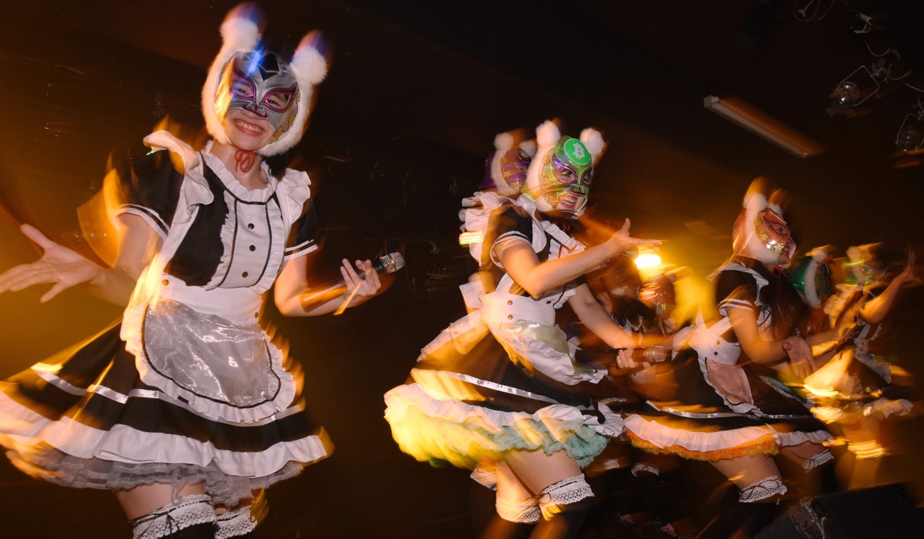 Female idol group Kasotsuka Shojo (Virtual Currency Girls) perform during a live stage show in Tokyo on January 12. Photo: AFP