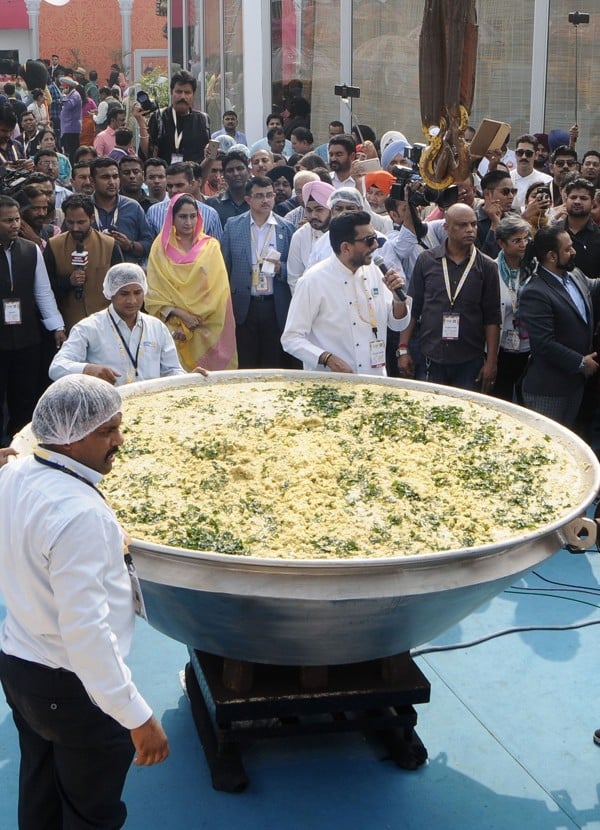 Chef Sanjeev Kapoor speaks at a World Food India 2017 event that saw a huge wok of khichdi cooked up. Picture: Anadolu Agency