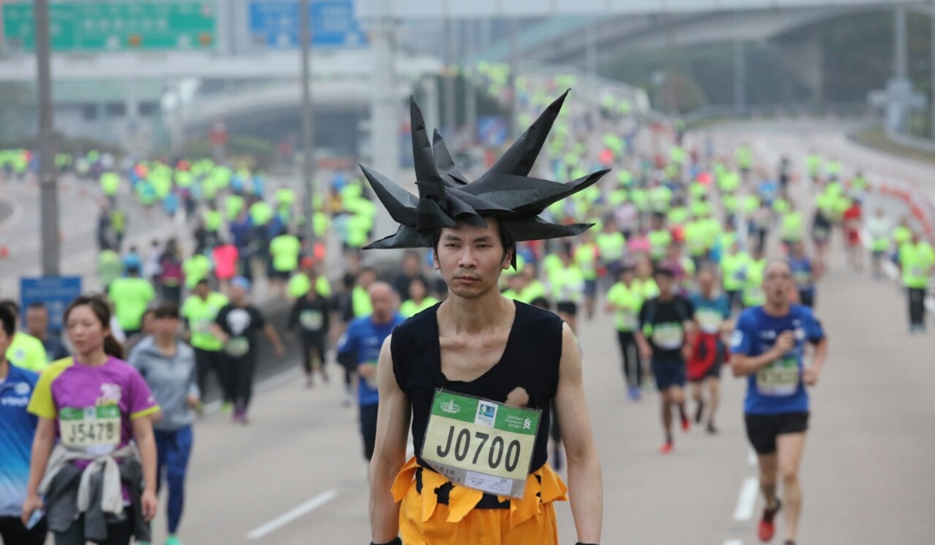 Another costumed runner, dressed as Goku from Dragon Ball Z, runs the Hong Kong Marathon. Photo: Felix Wong