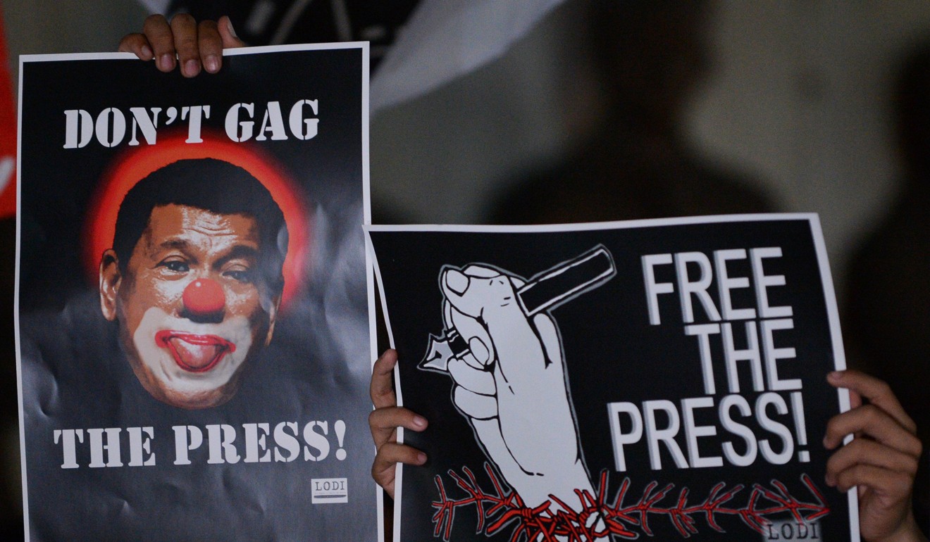 People in Manila protest for press freedom in Manila as news site Rappler faces multiple court challenges. Photo: AFP