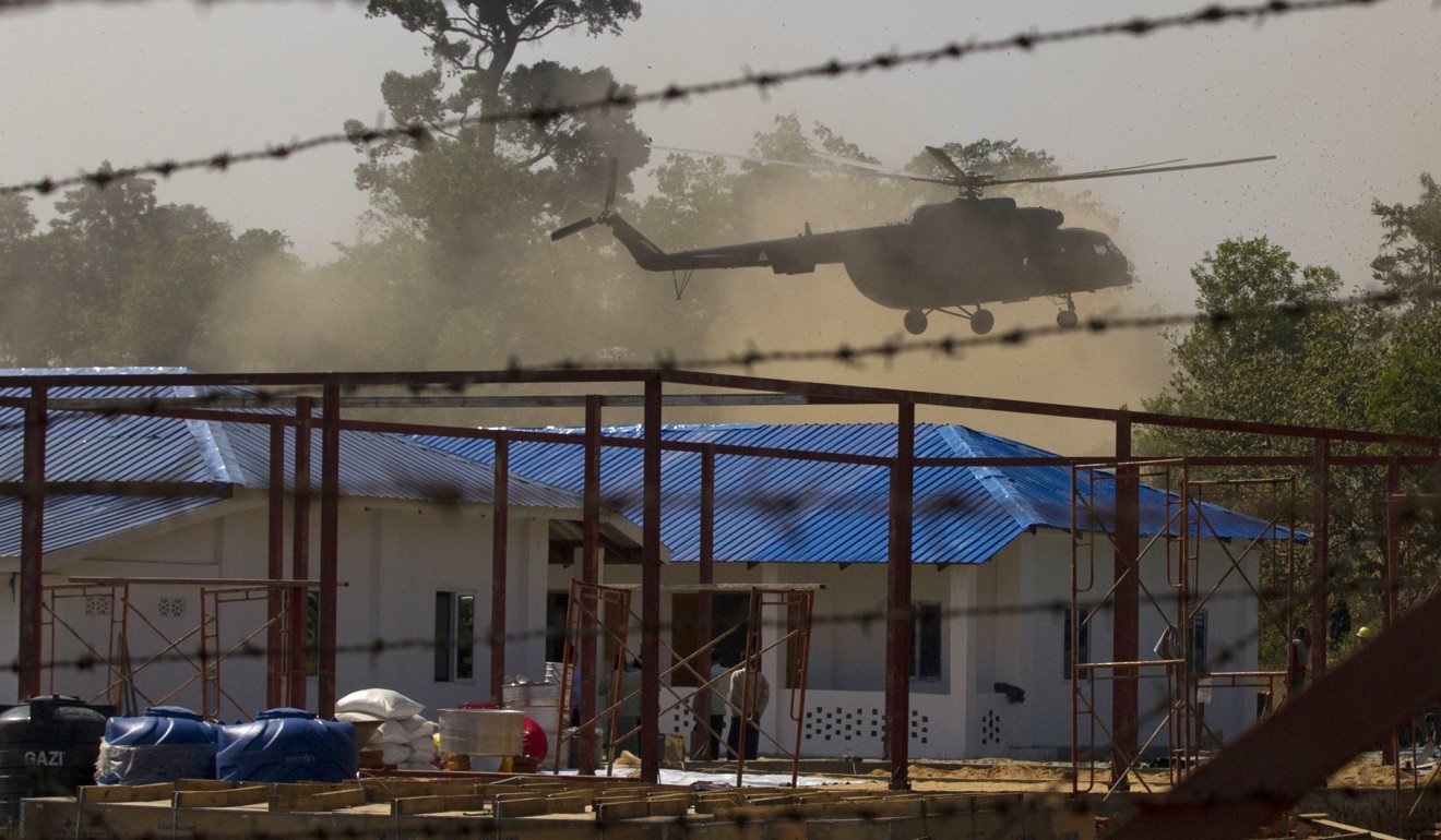A helicopter carrying an advisory commission including Bill Richardson lands near a newly-built repatriation camps prepared for Rohingya refugees expected to return from Bangladesh. Photo: AP