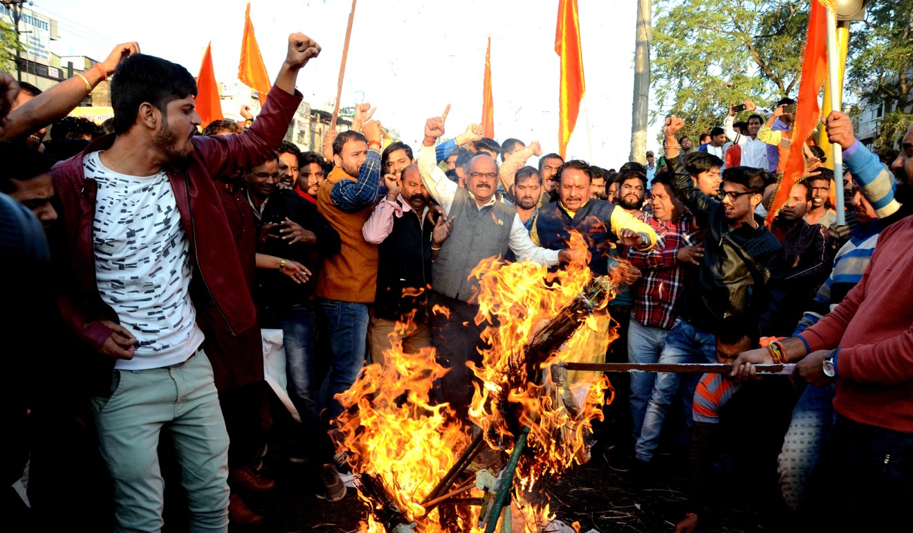 Protesters burn the effigy of Sanjay Leela Bhansali, the director of Padmaavat. Photo: EPA