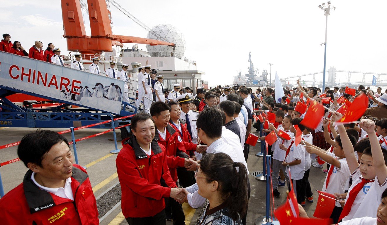 Members of a Chinese scientific expedition team are welcomed home in October after the Xue Long’s 83-day journey through the Canadian Arctic Archipelago. Photo: Xinhua