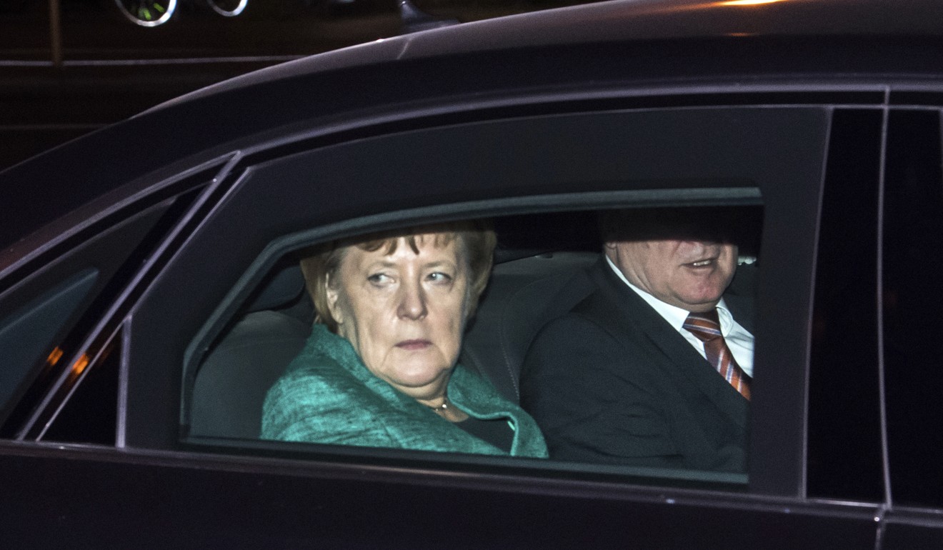 German Chancellor Angela Merkel arrives for a meeting with German President Frank-Walter Steinmeier at Bellevue Palace in Berlin on November 30. Four months after Germany’s 2017 federal elections, Merkel’s Christian Democratic Union/Christian Social Union is still trying to form a ruling coalition. Photo: AP