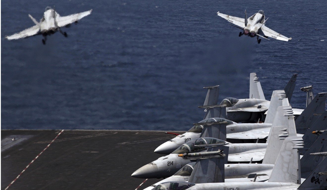 US fighter jets take off for a mission in Iraq from the flight deck of the US Navy aircraft carrier USS George H.W. Bush in the Persian Gulf. Though Saudi Arabia has begun to diversify its economic interests, providing increasing amounts of petroleum to China, it recognises that only the US has the military capacity to police the Gulf region. Photo: AP