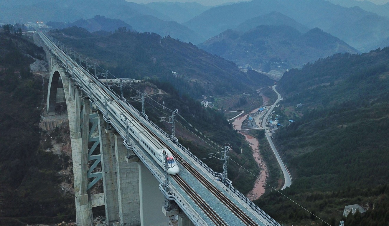 A high-speed train crosses the Yelang River Bridge in Tongzi county, Guizhou, on a test run this month. Photo: Xinhua