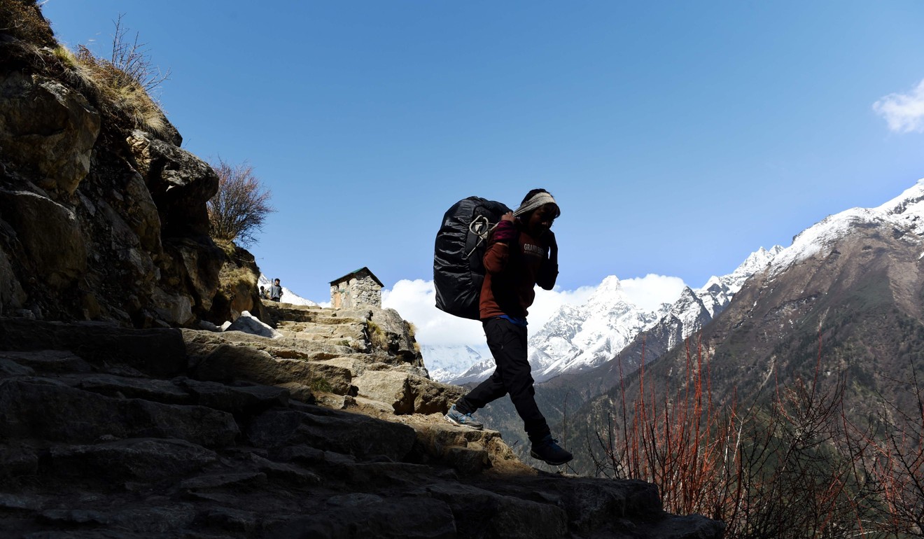 A Nepalese porter working near Pangboche in the Khumbu region of northeast Nepal. Photo: Agence France-Presse