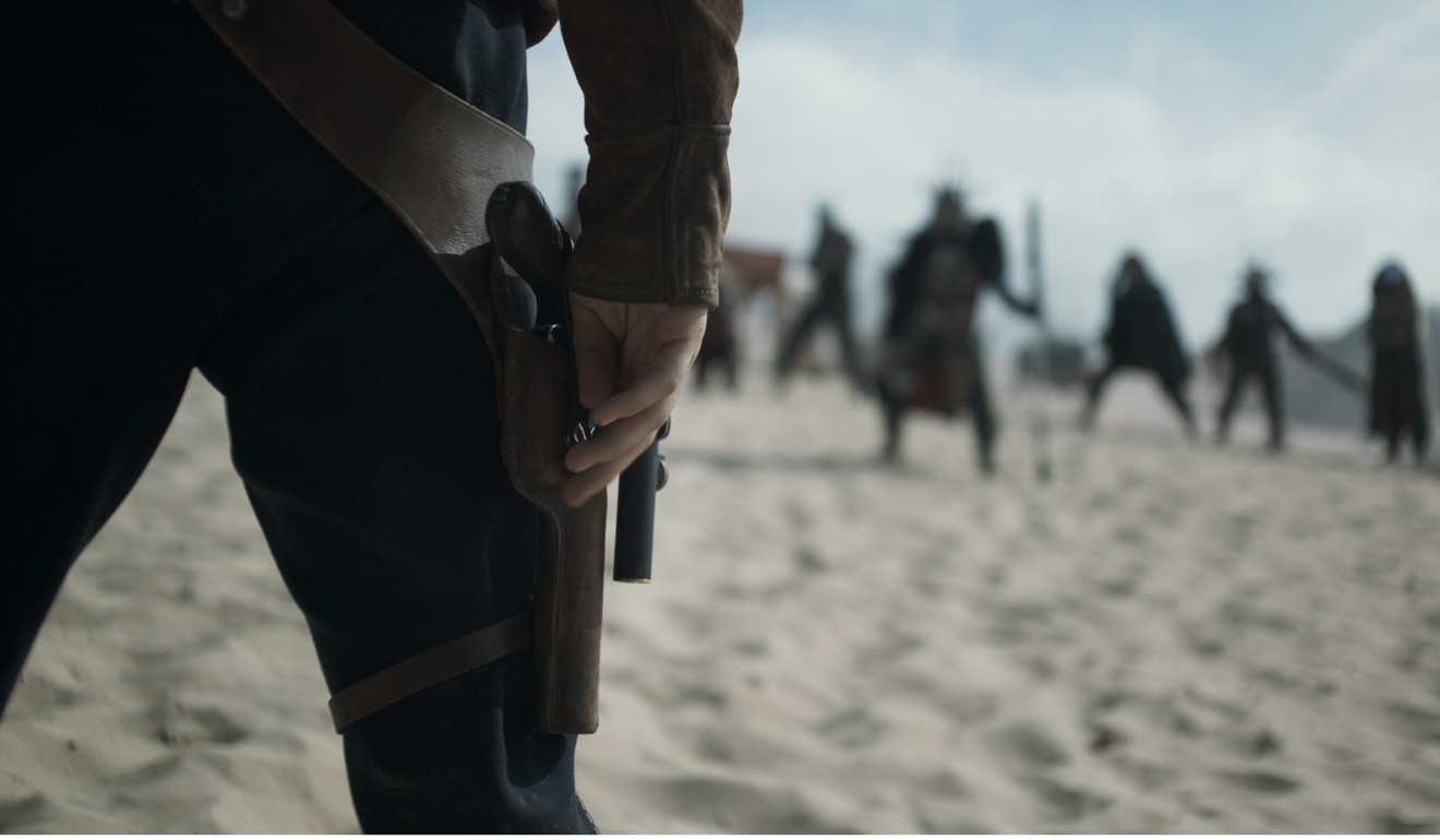 Han’s hand hovers near his holstered blaster in Solo. Photo: AP