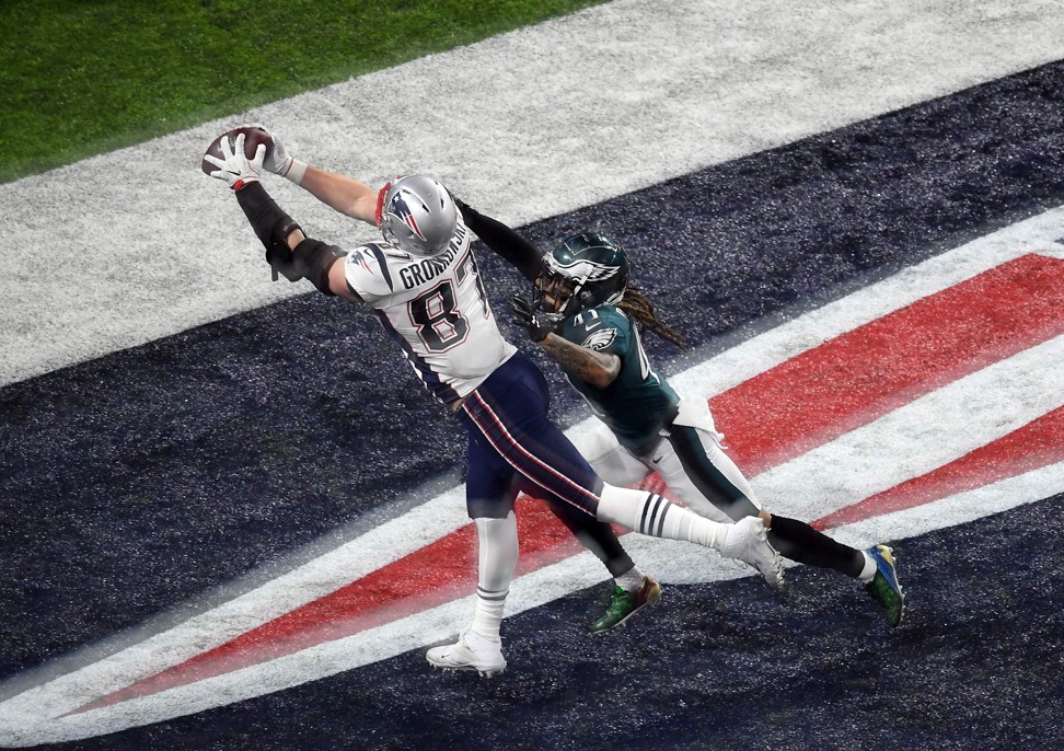 Rob Gronkowski scores a touchdown past Ronald Darby during Super Bowl LII against the Philadelphia Eagles. Photo: AFP