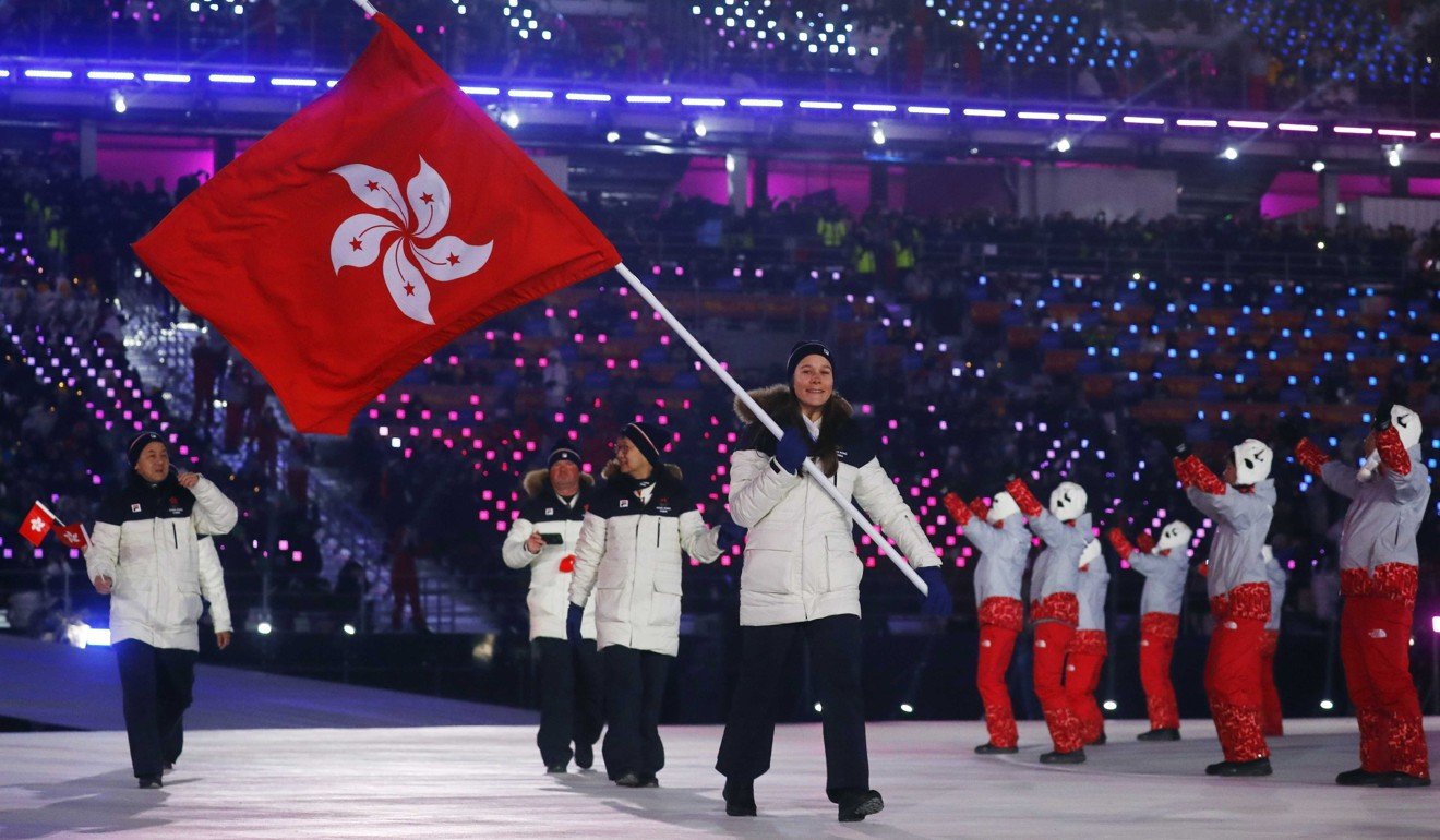 Arabella Ng carrying the Bauhinia flag during the opening ceremony. Photo: Reuters