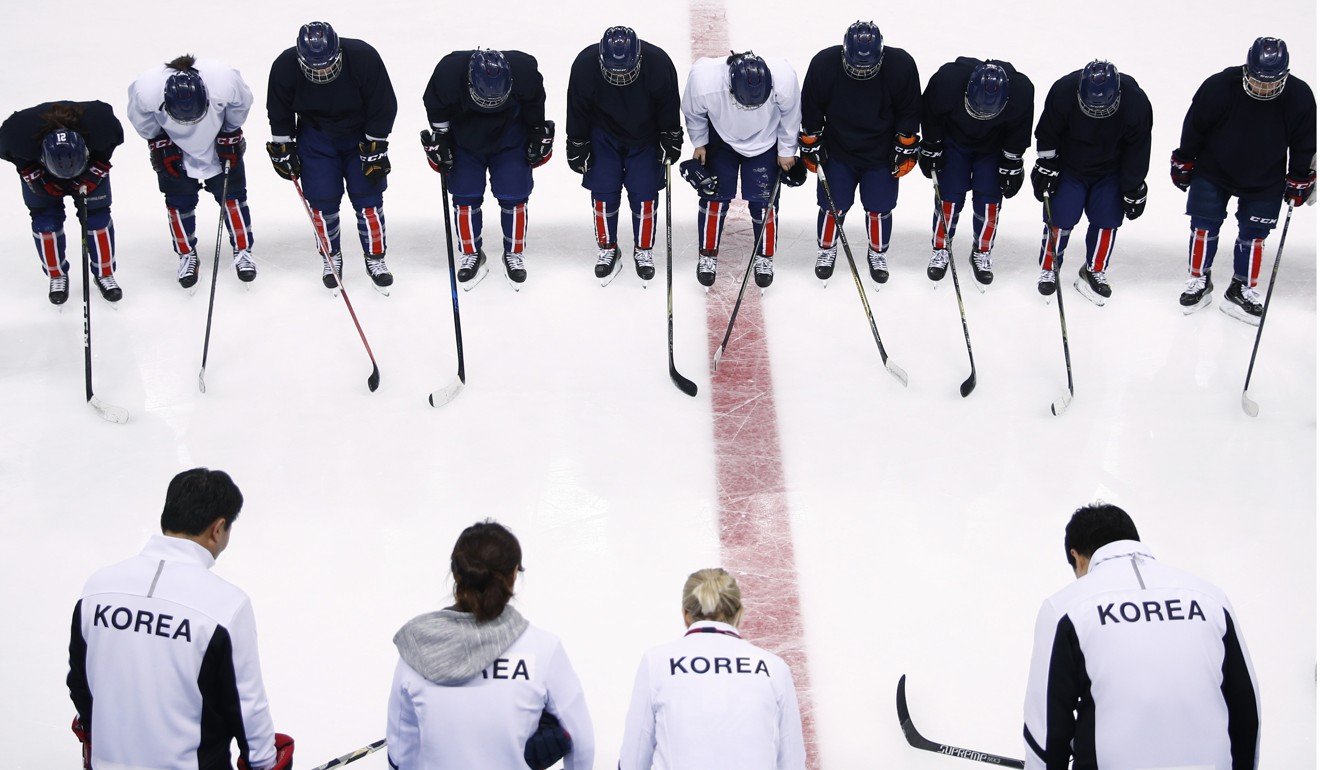 The combined Korean women’s ice hockey players bow to their coaching staff after a practice session. Photo: AP