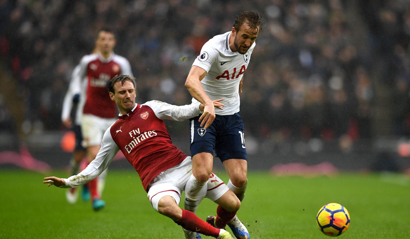 Harry Kane is tackled by Arsenal's Nacho Monreal. Photo: EPA