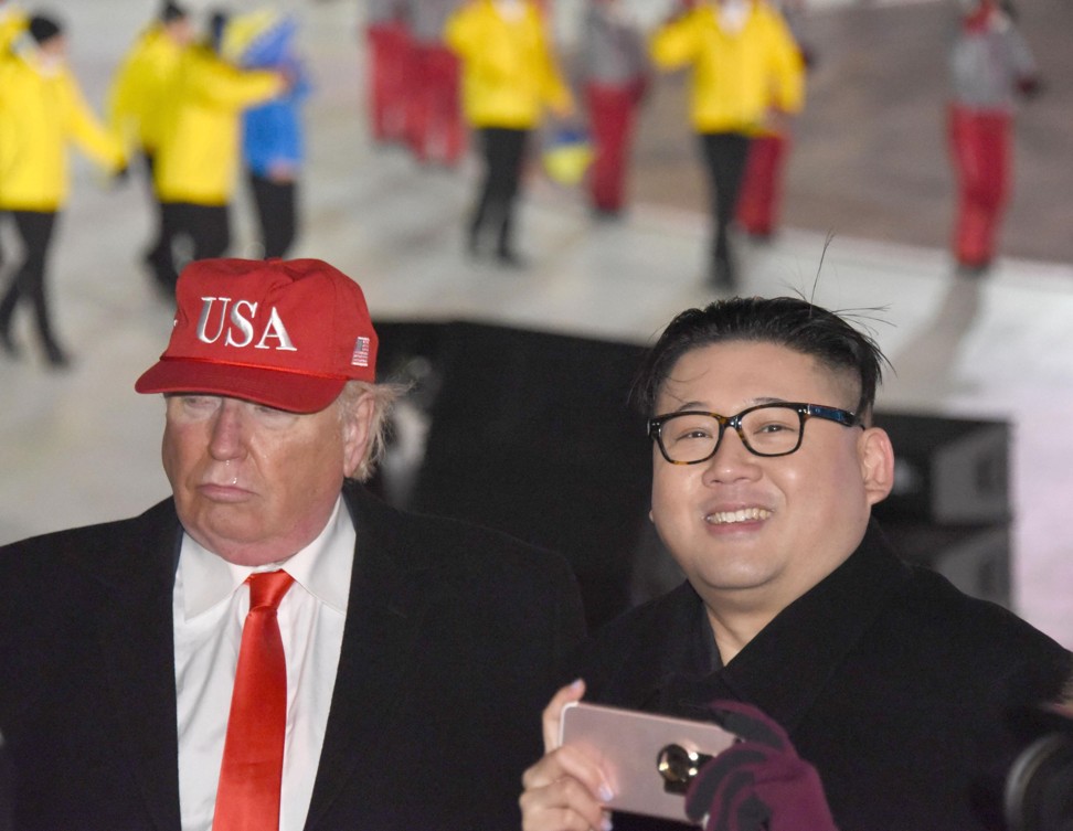 ‘Trump’ and ‘Kim’ were escorted from the media area. Photo: Kyodo
