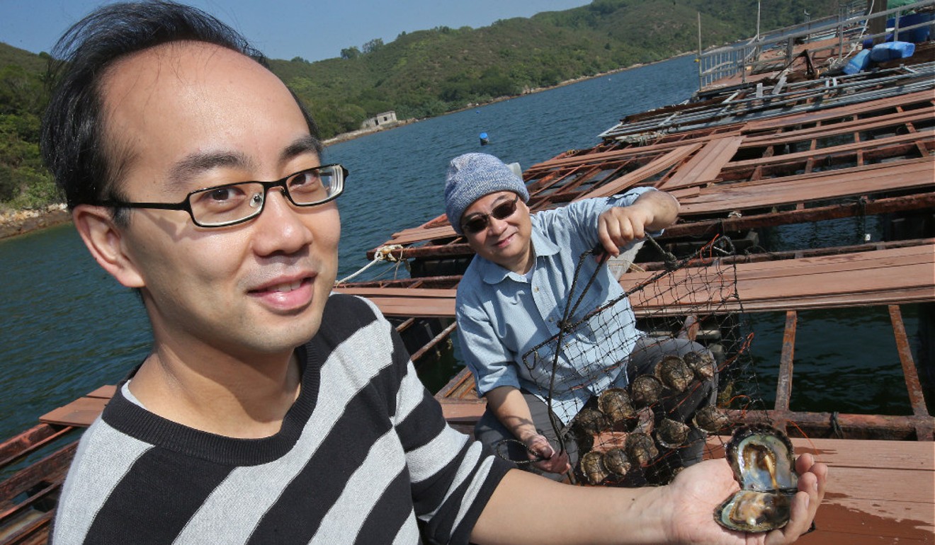 David Wong (left) and Yan Wa-tat on their oyster raft. Picture: David Wong