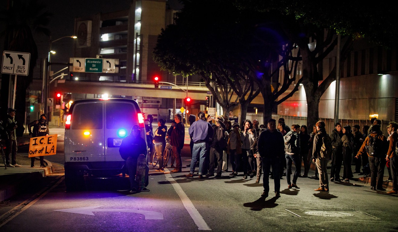 Protesters block the ICE van on Thursday in LA. Photo: Los Angeles Times via TNS
