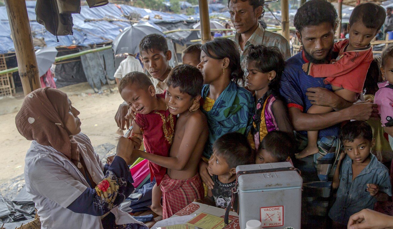 A Bangladeshi health worker gives a vaccination to a Rohingya Muslim boy who crossed over from Myanmar into Bangladesh. If a flu pandemic strikes, the populations of poorer, less-developed communities are likely to be hardest hit. Photo: AP 