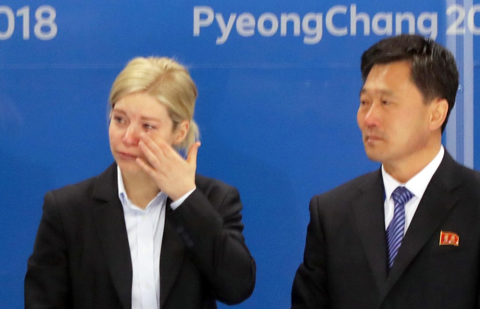 Sarah Murray, head coach of the unified inter-Korean team, sheds tears next to North Korean coach Pak Chul-ho. Photo: EPA