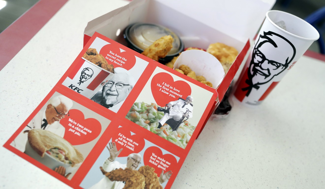 Valentine's Day scratch-and-sniff cards, which give off a fried chicken aroma, sit on a table at a KFC. Photo: AP