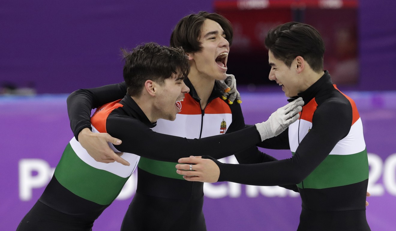 (From left) Csaba Burjan, Liu Shaolin Sandor and Liu Shaoang of Hungary celebrate after winning the 5,000 meters short track speedskating relay final. Photo: AP