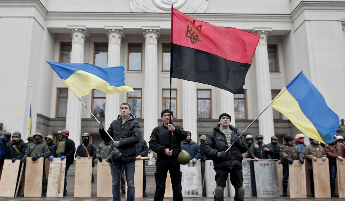Anti-government forces guard the entrance of the Ukrainian parliament in February 2014, when they seized it from president at the time Viktor Yanukovich. Photo: AFP