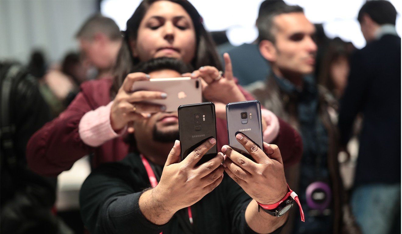 Attendees photograph Galaxy S9 smartphones during a Samsung launch event ahead of the Mobile World Congress in Barcelona, Spain. Photo: Bloomberg