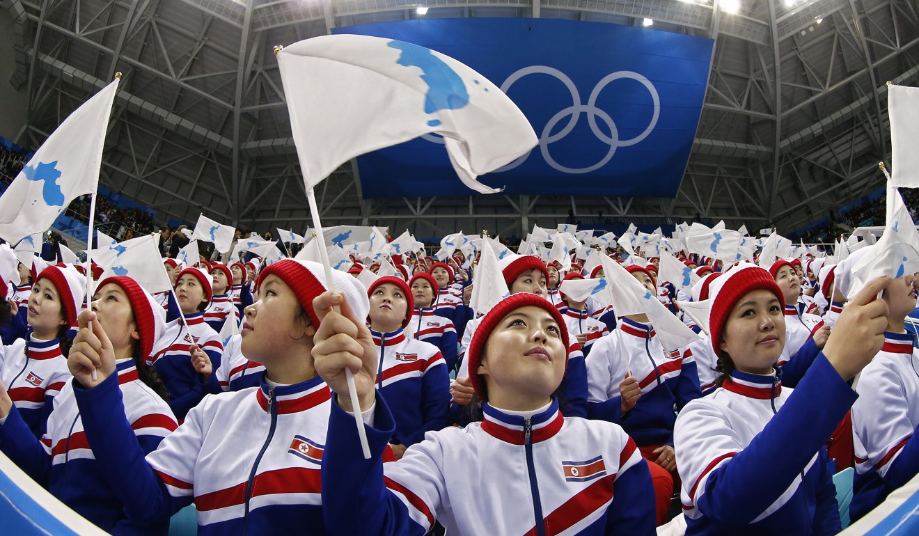 North Korean cheerleaders wave the Korean Unification Flag before the men's ice hockey preliminary round match between the Czech Republic and South Korea at the Gangneung Hockey Centre during the Pyeongchang 2018 Winter Olympic Games, in Gangneung, South Korea, 15 February 2018. Photo: EPA-EFE
