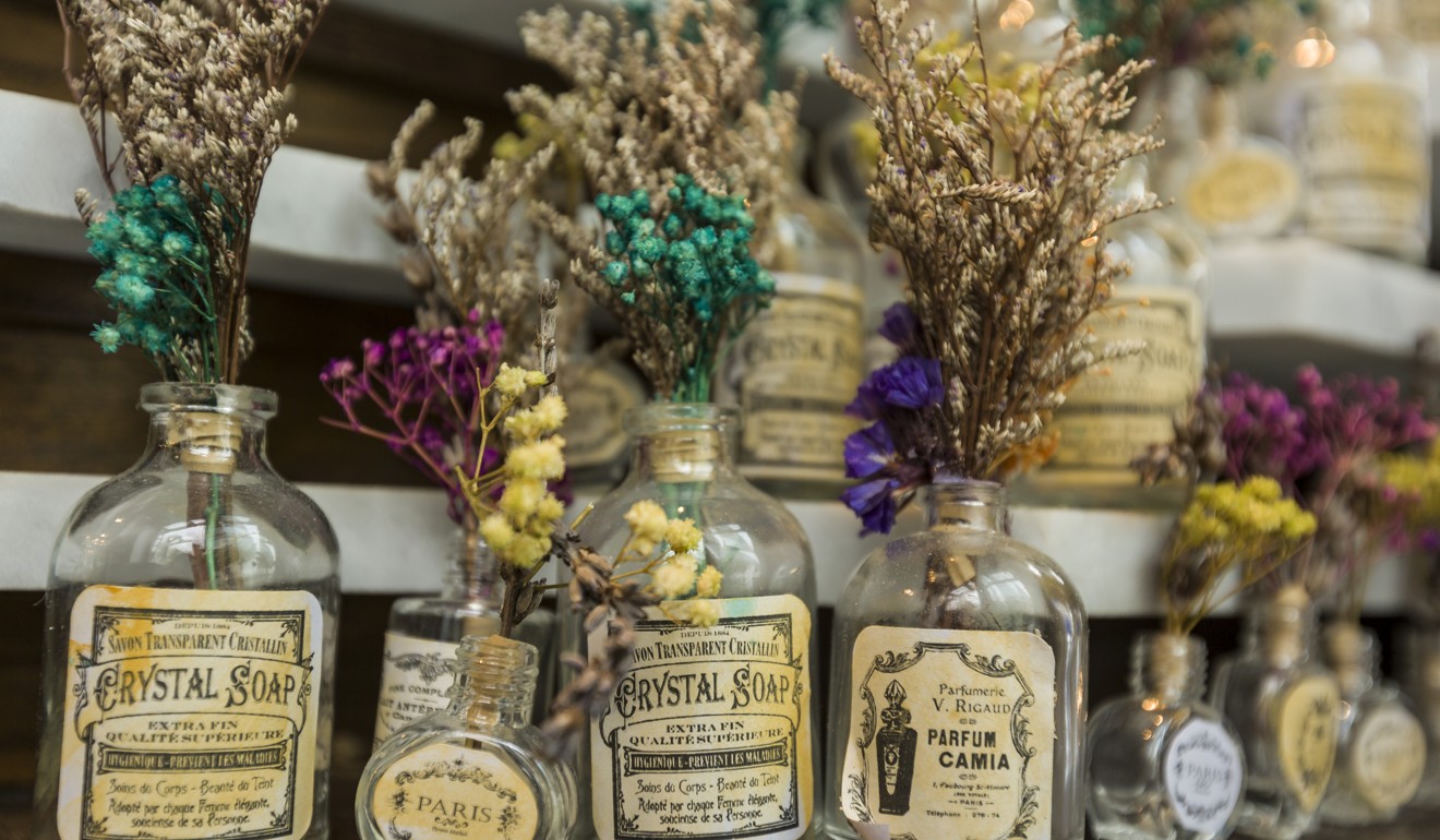 Dried flowers have been placed in tiny bottles throughout the restaurant.