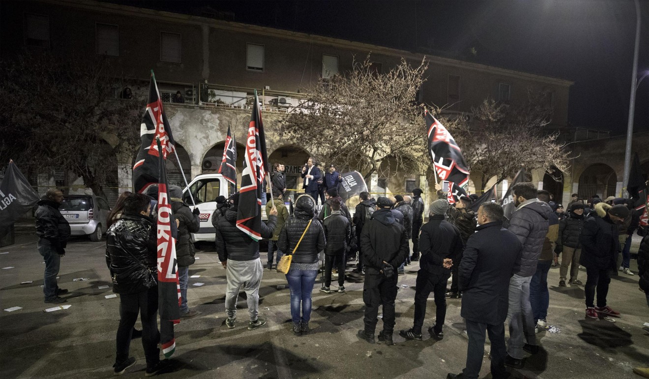 Leader of Italian far-right movement Forza Nuova (New Force), Roberto Fiore, standing on a truck, speaking at a rally in Rome. Photo: AP