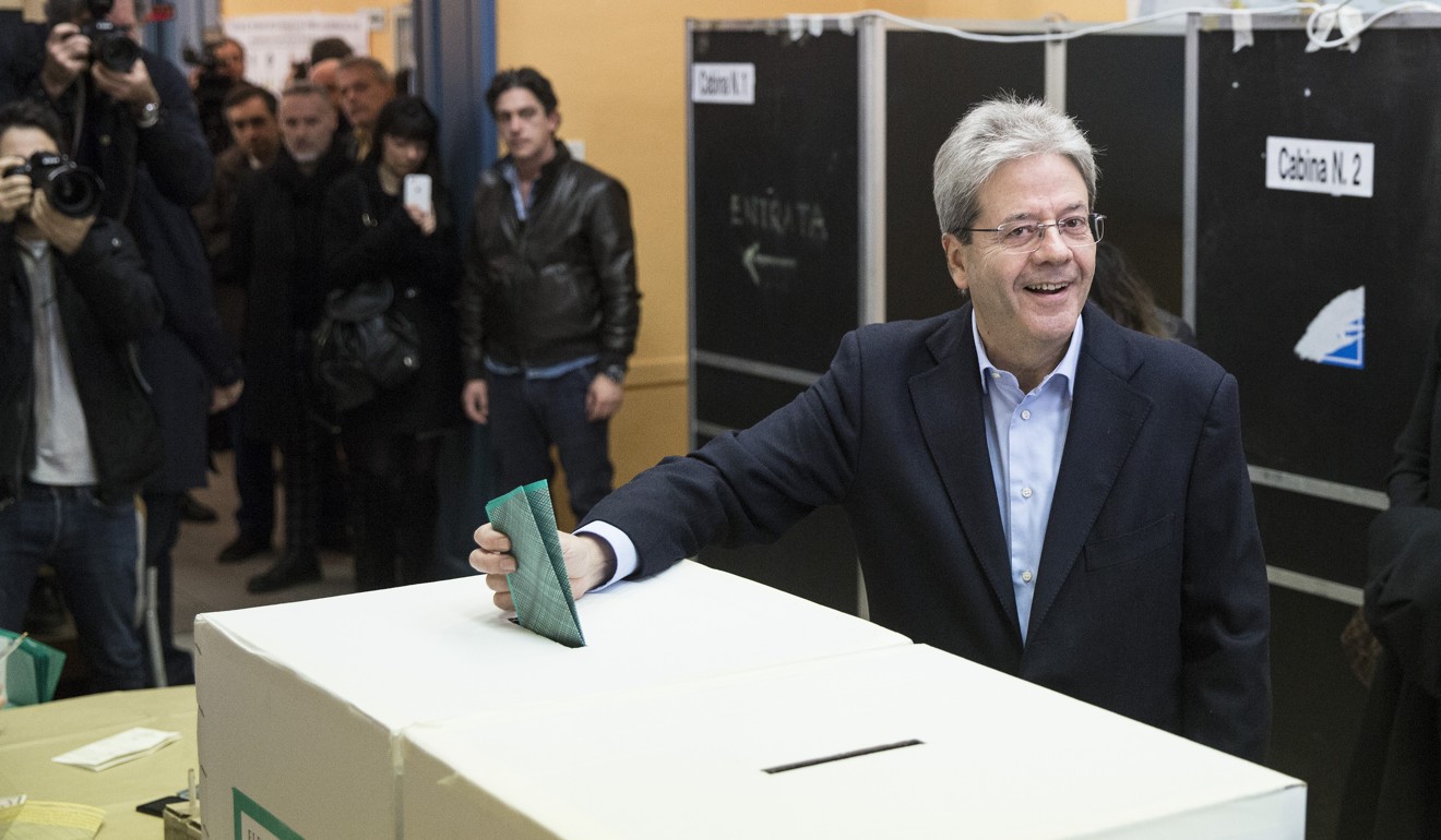 Glitches, confusion and a naked protester mark Italian election