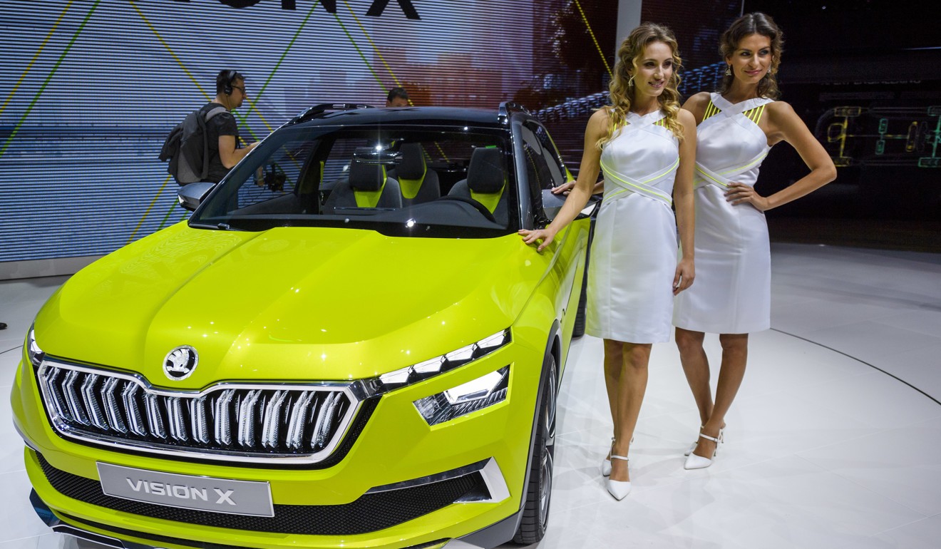 Two models pose next to the new Skoda Vision X at the 88th Geneva International Motor Show in Switzerland. Photo: AP