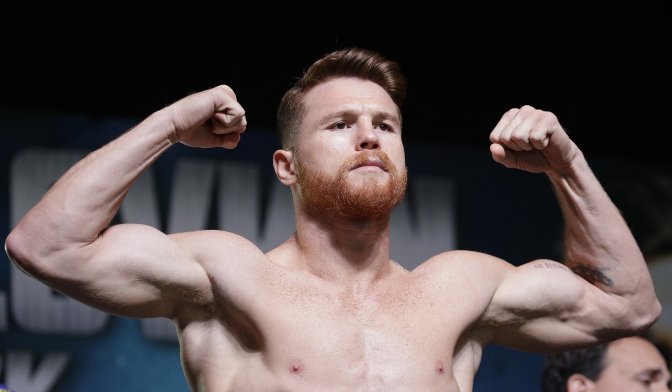 Canelo Alvarez poses on the scale during the weigh-in. Photo: AP