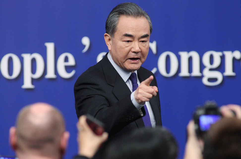 China’s Foreign Minister Wang Yi wags his finger at a reporter as he leaves the podium after telling a press conference in Beijing that ‘certain external powers’ wanted to ‘stir up trouble’ in the South China Sea. Photo: Simon Song