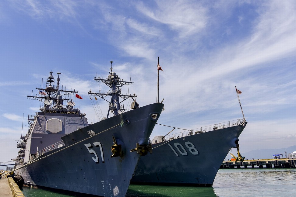 The US Navy’s guided missile cruiser USS Lake Champlain (left) and destroyer USS Wayne E. Meyer accompanied aircraft carrier USS Carl Vinson on its port visit to Dan Nang in Vietnam. Photo: EPA-EFE