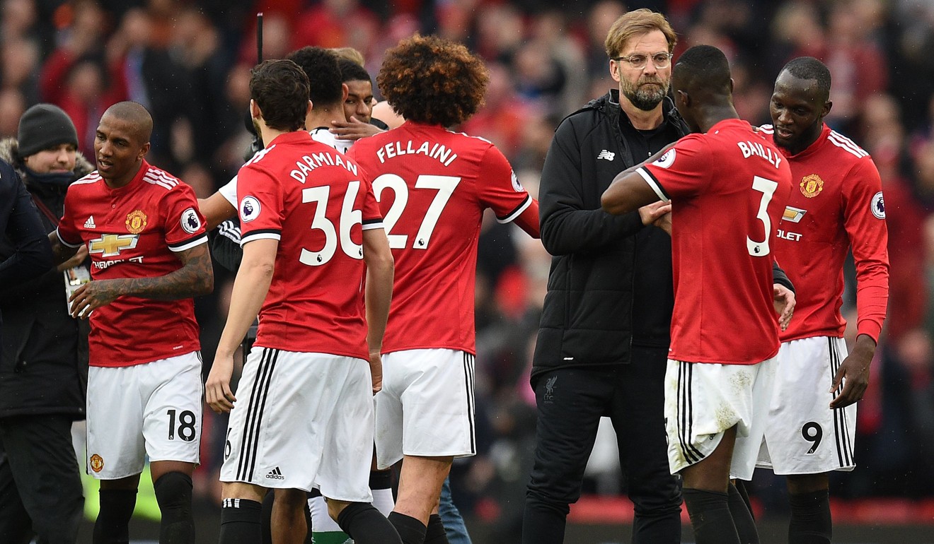Liverpool manager Jurgen Klopp greets Manchester United's Ivorian defender Eric Bailly at the end of the match. Photo: AFP